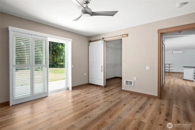 a view of a livingroom with wooden floor