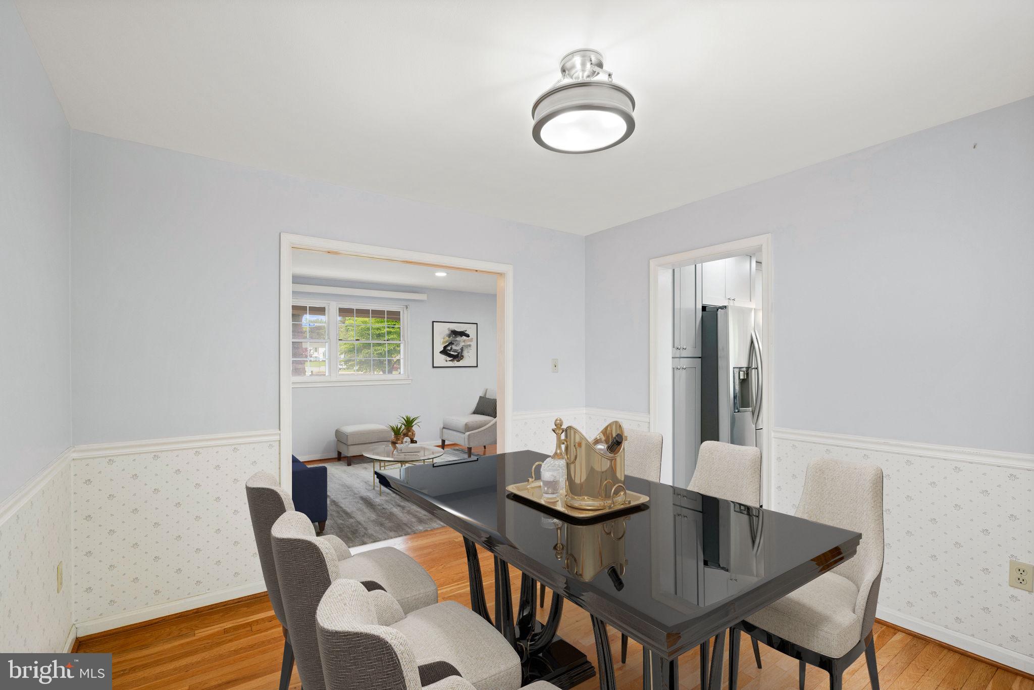 5615 Rolling Road Springfield, VA 22151 - Photo 12 of 56 Virtually staged Din Rm view to Kit-Liv Rm