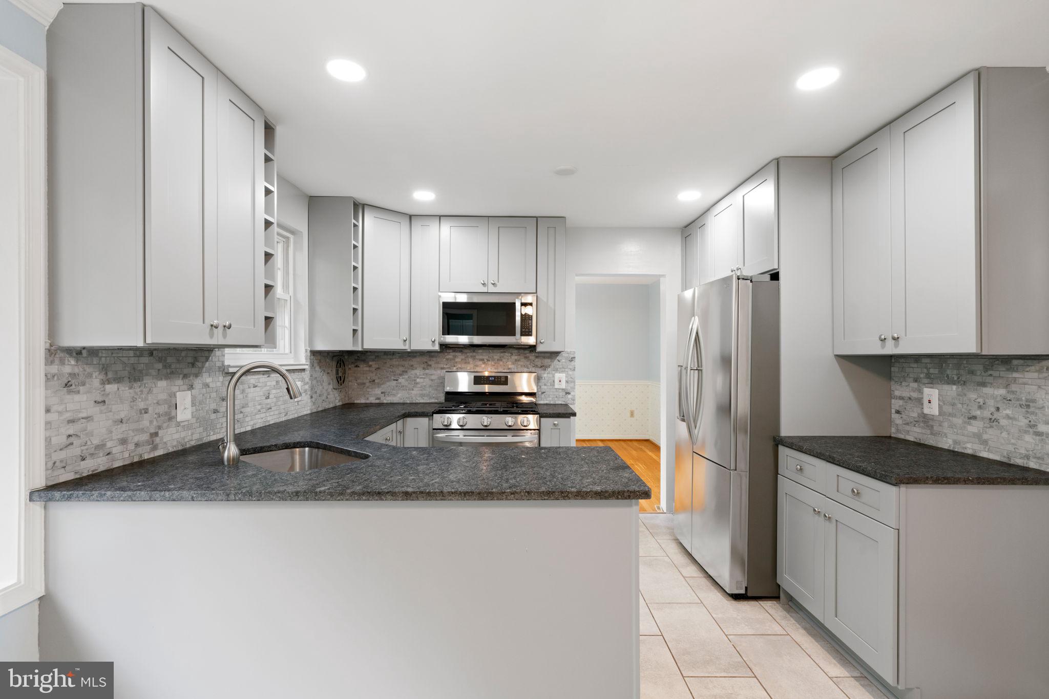 5615 Rolling Road Springfield, VA 22151 - Photo 14 of 56 Well-pointed updates glisten!