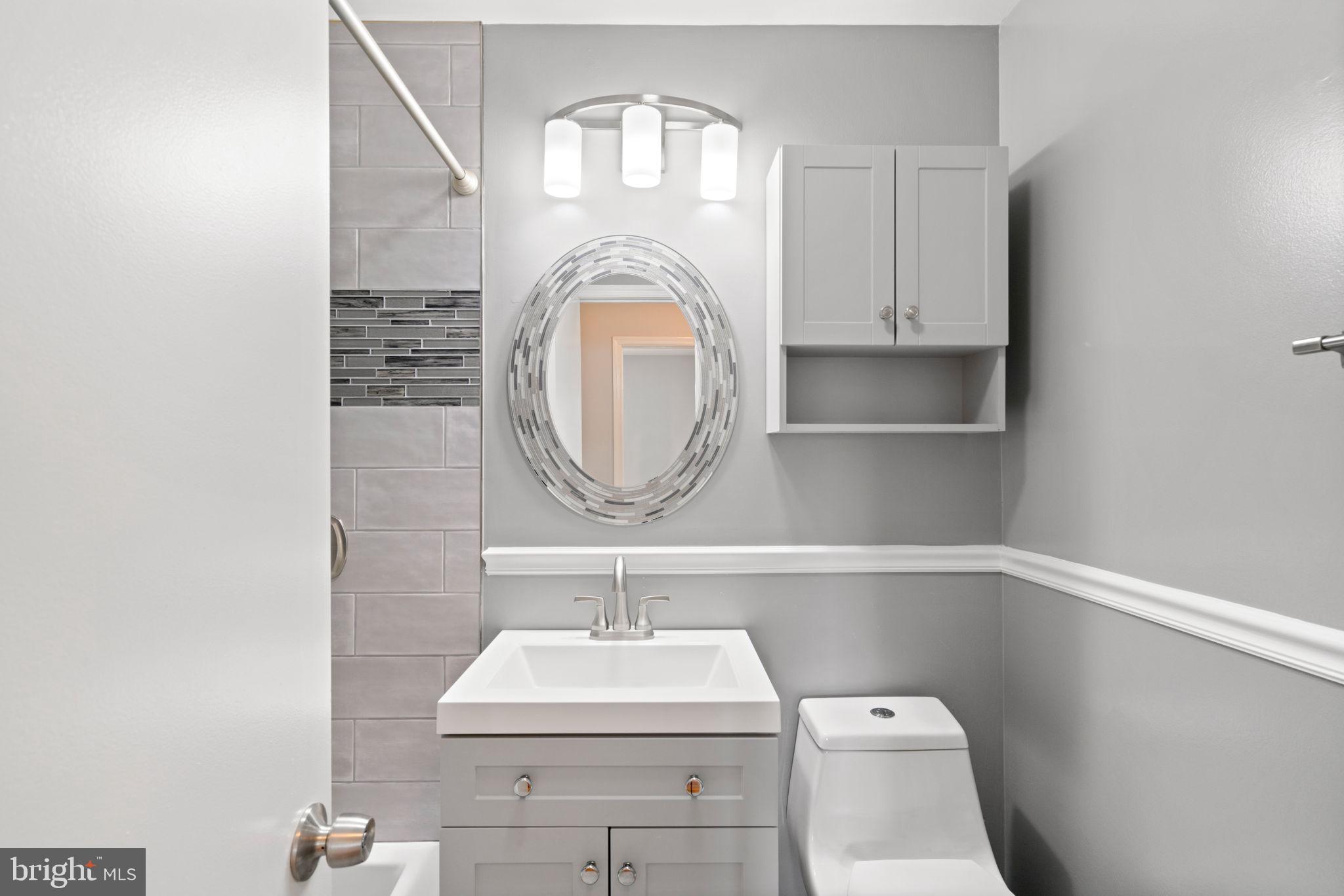 5615 Rolling Road Springfield, VA 22151 - Photo 29 of 56 Updated Hall bathroom with tile & style!