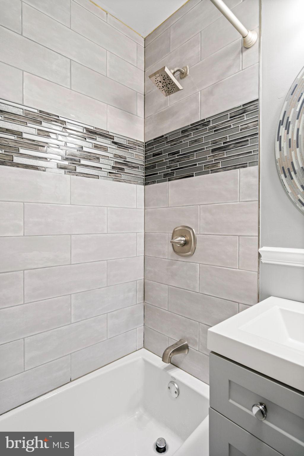 5615 Rolling Road Springfield, VA 22151 - Photo 30 of 56 Tub-shower in the hall bathroom