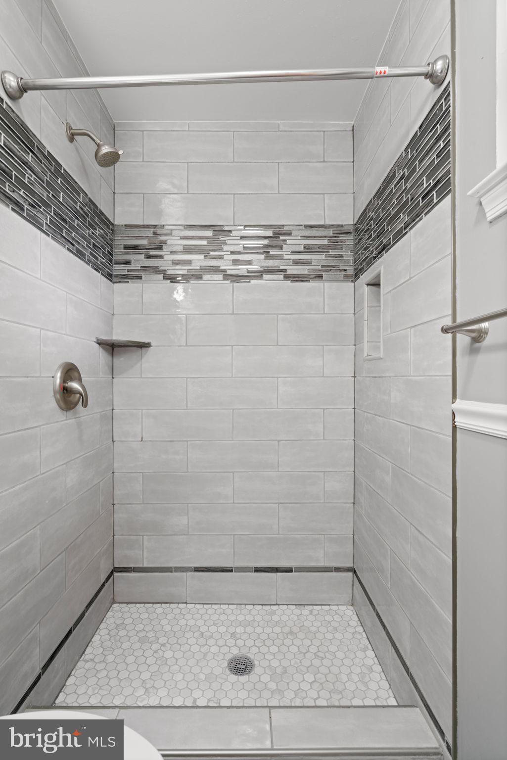 5615 Rolling Road Springfield, VA 22151 - Photo 37 of 56 Tile and Style in the shower stall Primary Bath