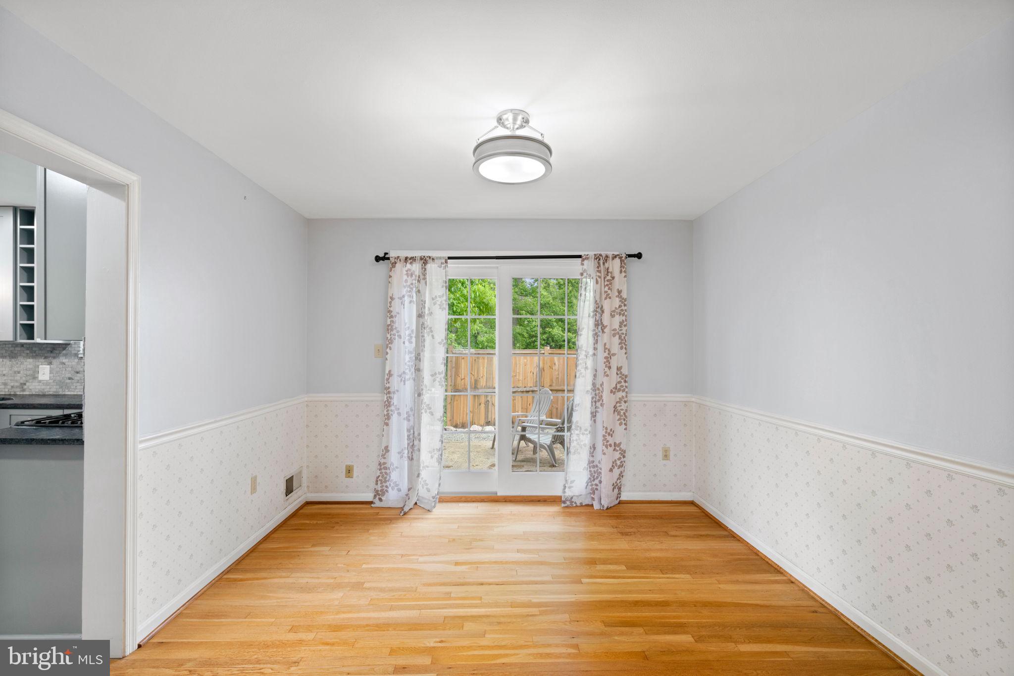 5615 Rolling Road Springfield, VA 22151 - Photo 10 of 56 Formal Dining Room to Fenced yard & patio