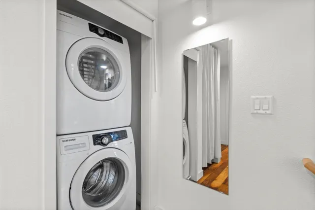 a view of a storage & utility room with dryer and washer