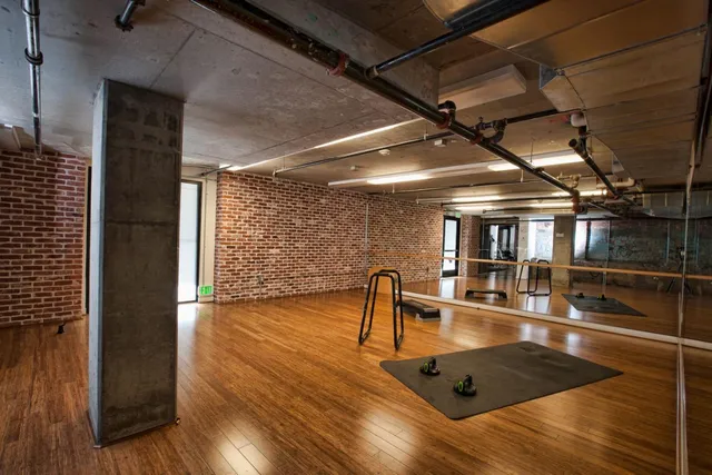 a view of a porch with a table and chairs