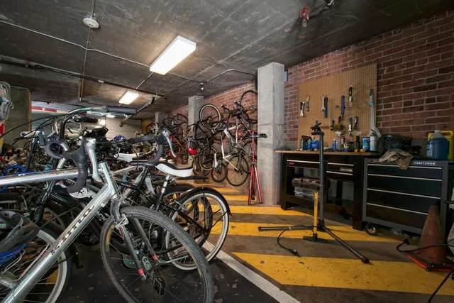 a view of a patio with a table and chairs under an umbrella