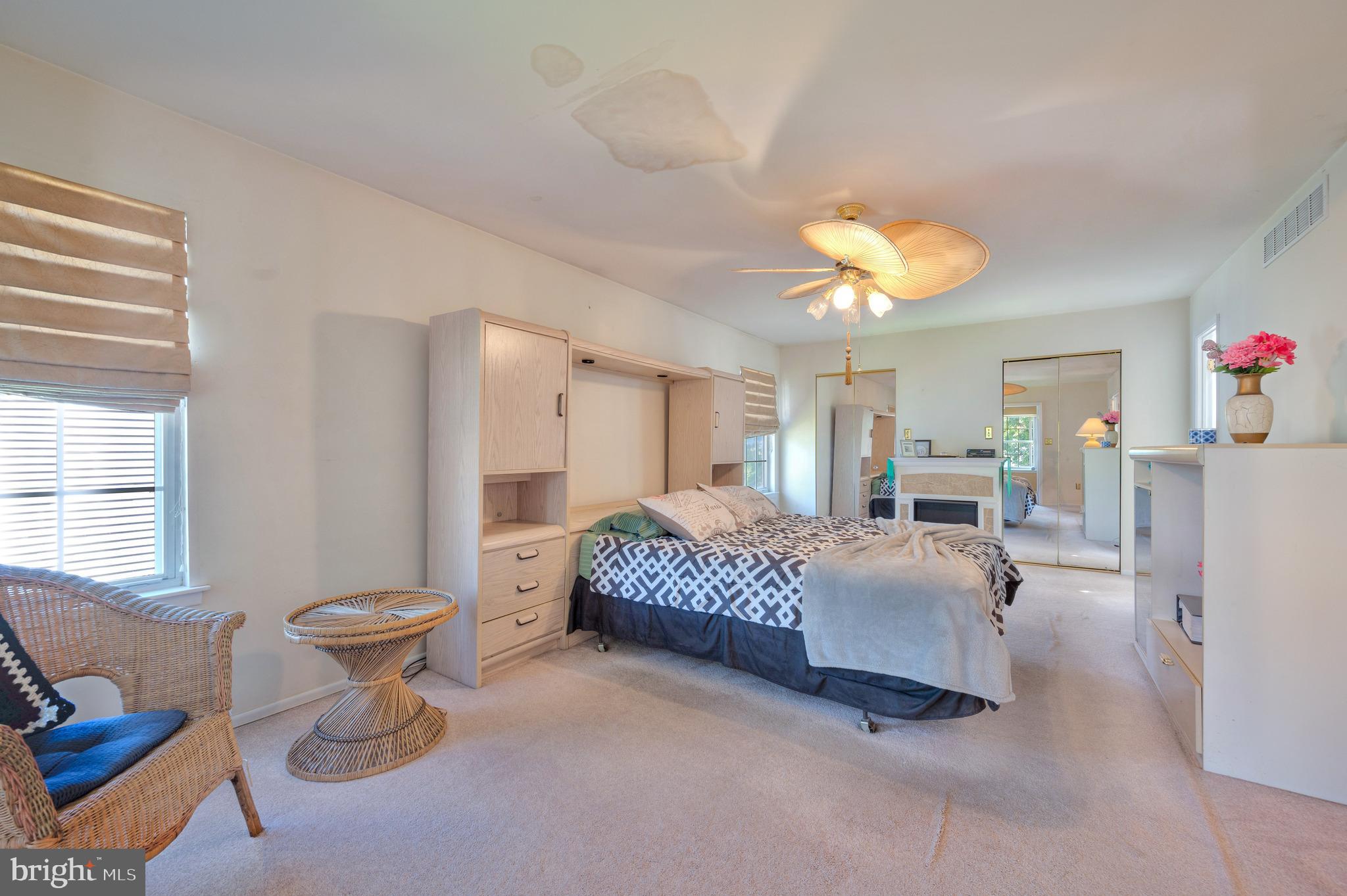 13360 Susan Terrace Philadelphia, PA 19116 - Photo 12 of 29 a spacious bedroom with a bed and a chandelier