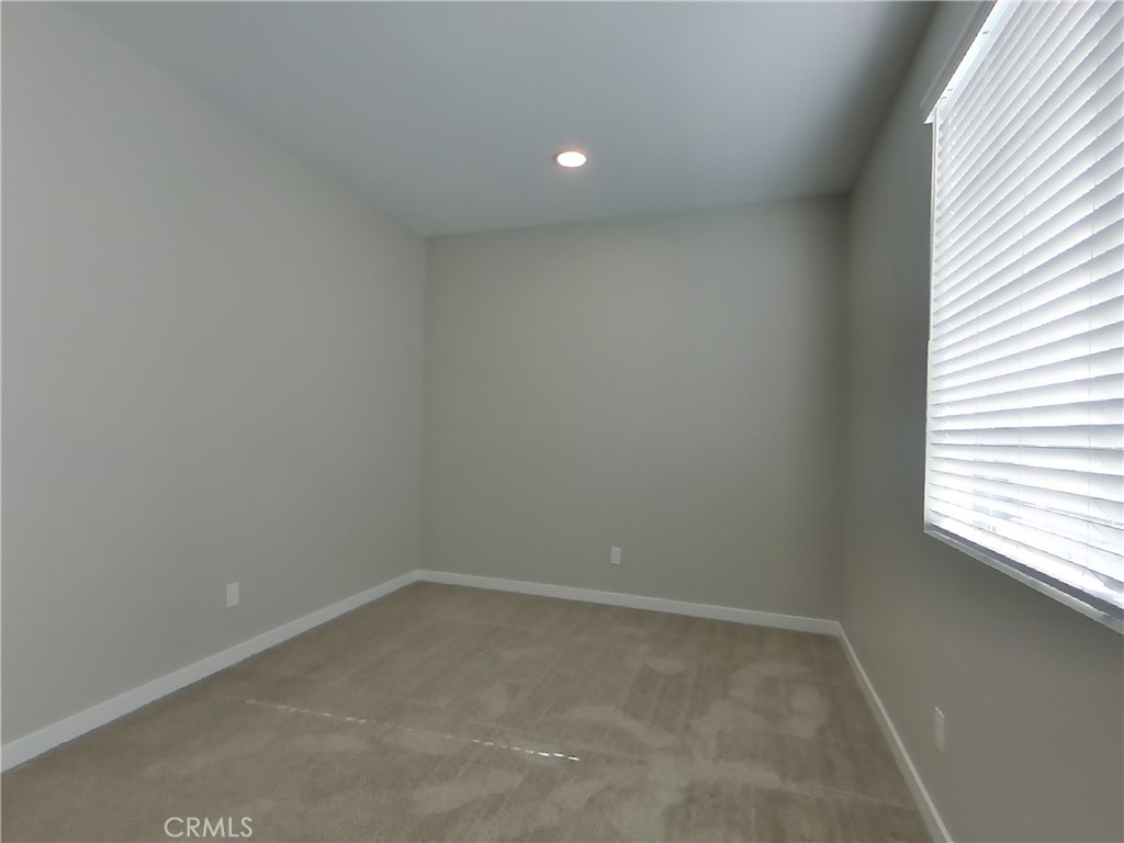 24944 Siempre Court Wildomar, CA 92595 - Photo 12 of 31 a view of an empty room and a window