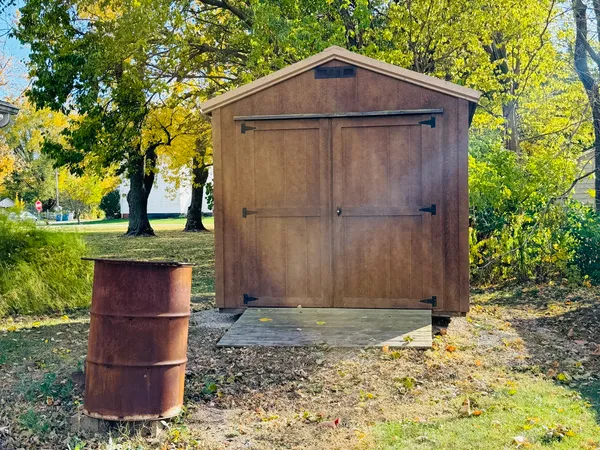 a wooden door in front of a house