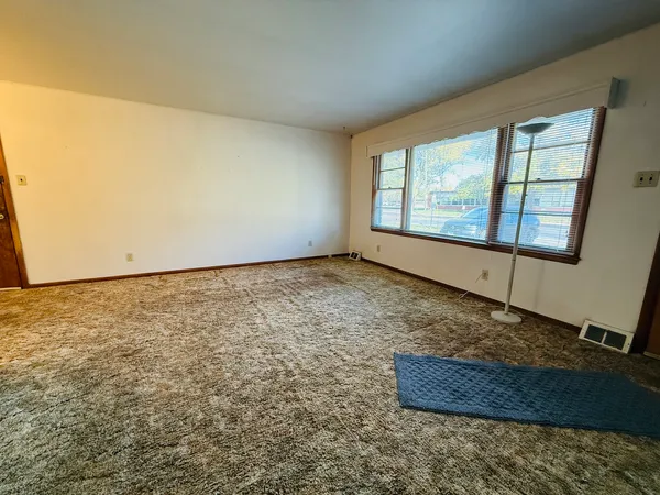 an empty room with a chandeliers