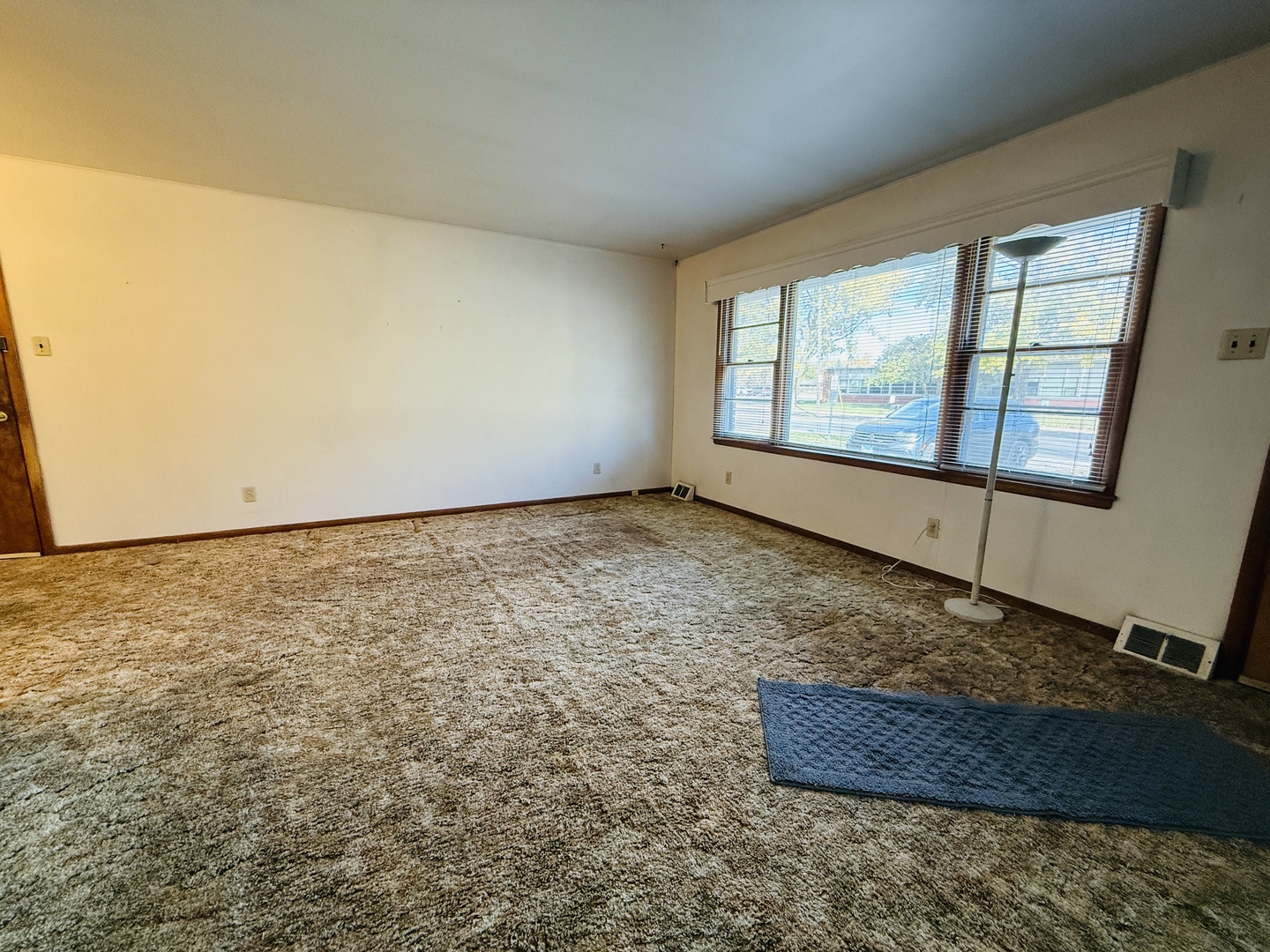306 7th Street Cornell, IL 61319 - Photo 4 of 17 an empty room with a chandeliers