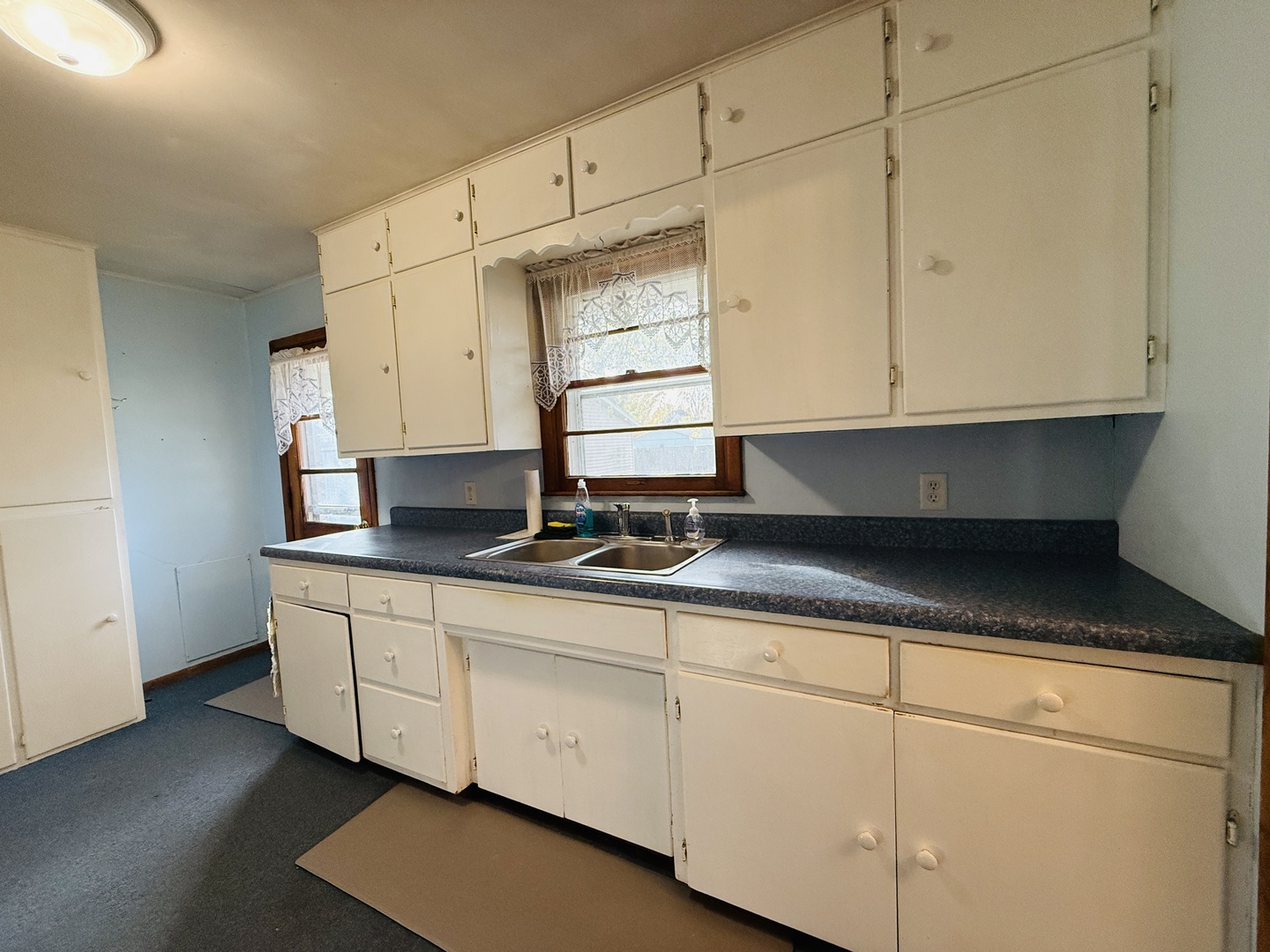 306 7th Street Cornell, IL 61319 - Photo 6 of 17 a kitchen with granite countertop white cabinets and sink