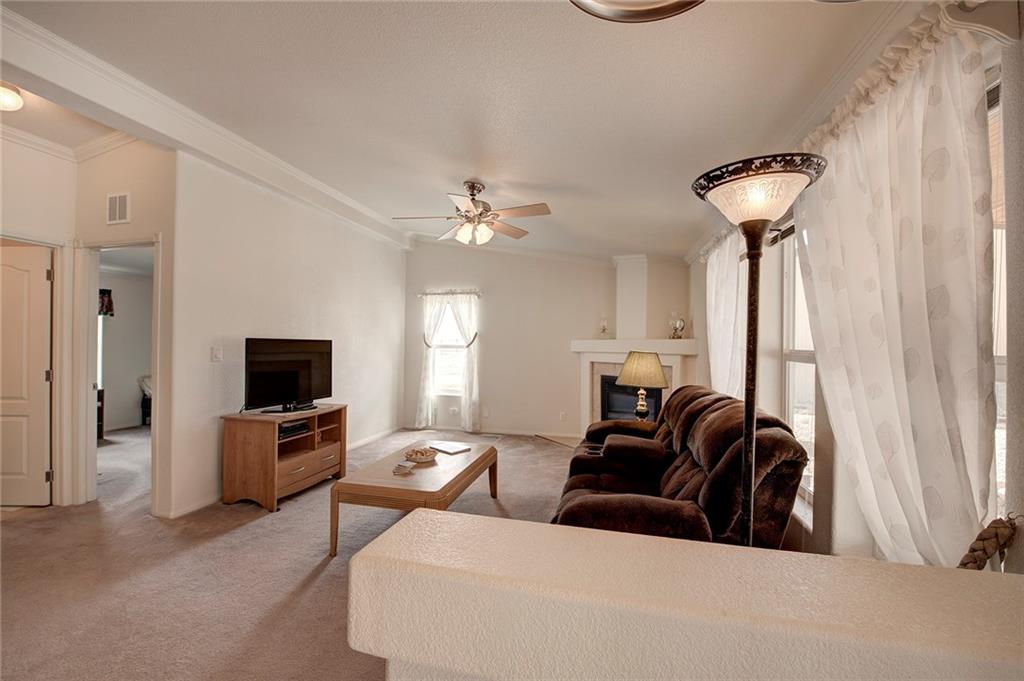 6186 Ranch Road Hartsel, CO 80449 - Photo 13 of 30 a living room with furniture and a chandelier