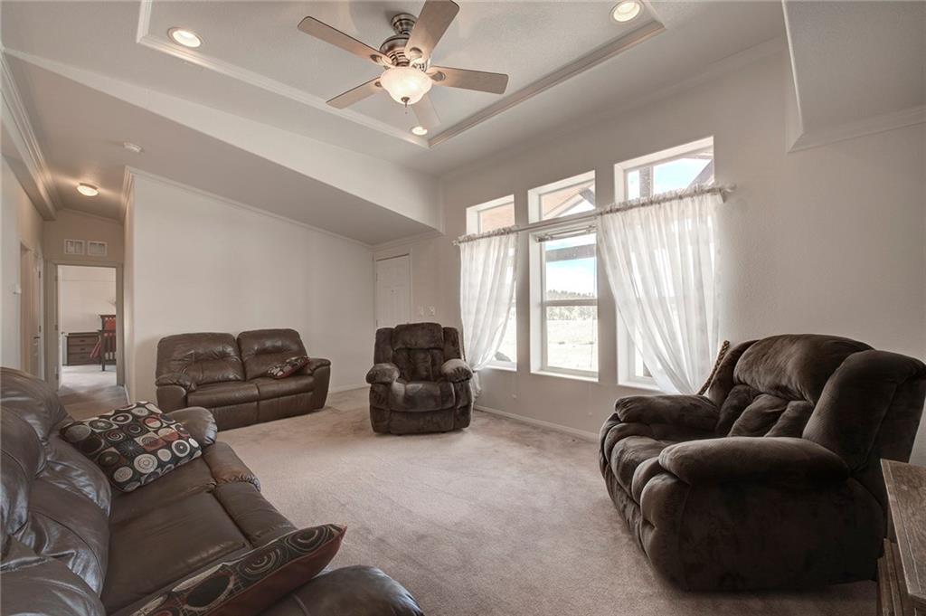 6186 Ranch Road Hartsel, CO 80449 - Photo 17 of 30 a living room with furniture and a large window