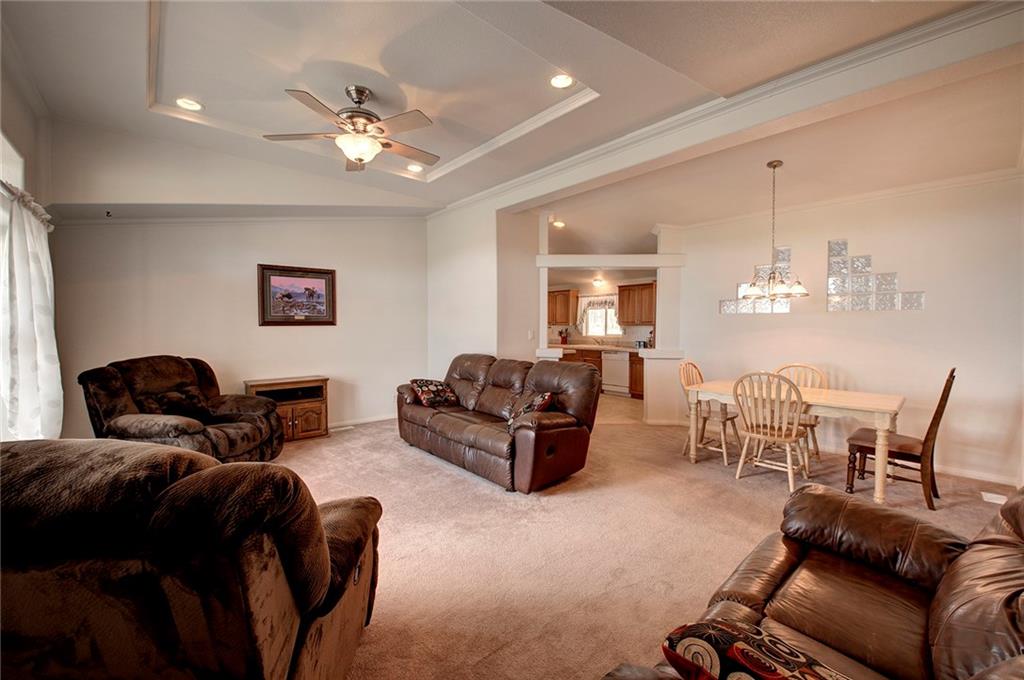 6186 Ranch Road Hartsel, CO 80449 - Photo 18 of 30 a living room with furniture and a chandelier