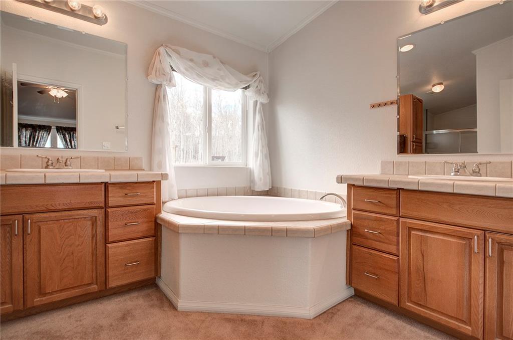 6186 Ranch Road Hartsel, CO 80449 - Photo 22 of 30 a bathroom with a sink and a mirror
