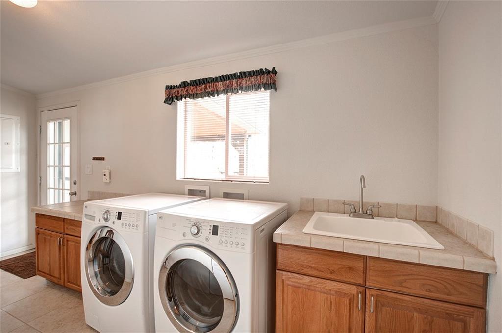 6186 Ranch Road Hartsel, CO 80449 - Photo 27 of 30 a utility room with dryer and washer