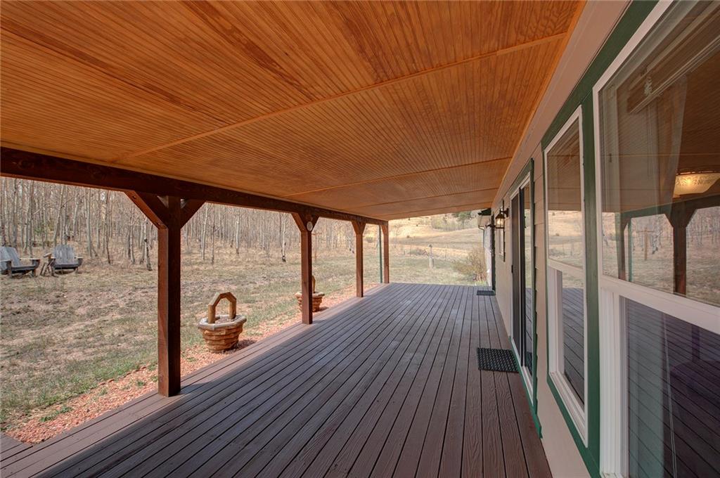 6186 Ranch Road Hartsel, CO 80449 - Photo 7 of 30 a view of a room with wooden floor and iron stairs
