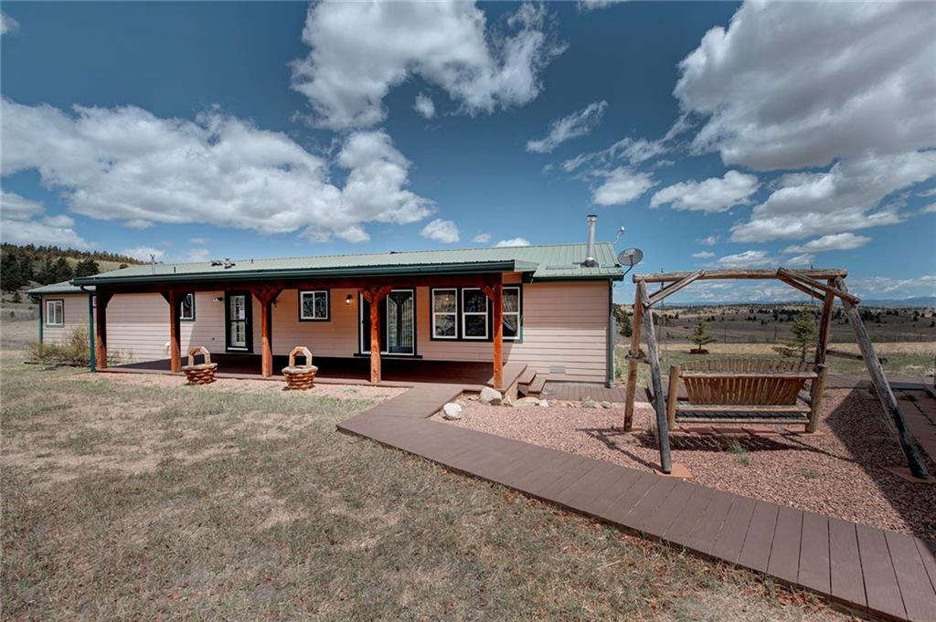 6186 Ranch Road Hartsel, CO 80449 - Photo 10 of 30 a view of a house with backyard and sitting area