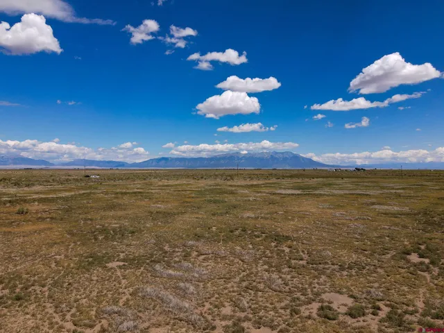 a view of an ocean and a mountain
