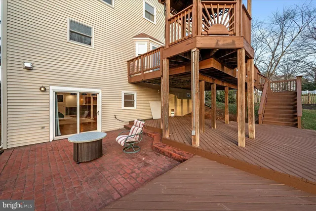 a view of a patio with a table and chairs