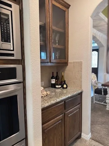 a kitchen with a stove and a microwave