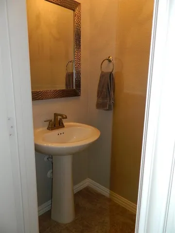 a bathroom with a sink and mirror