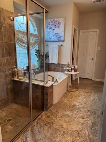a bathroom with a tub and a sink