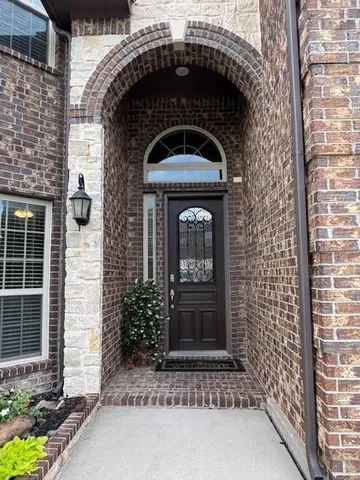 a close view of a house with a door and a window