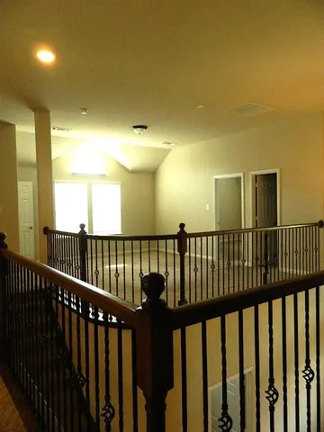 a view of staircase with a large window