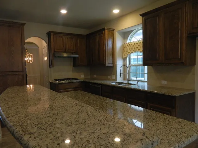 a kitchen with a sink and cabinets