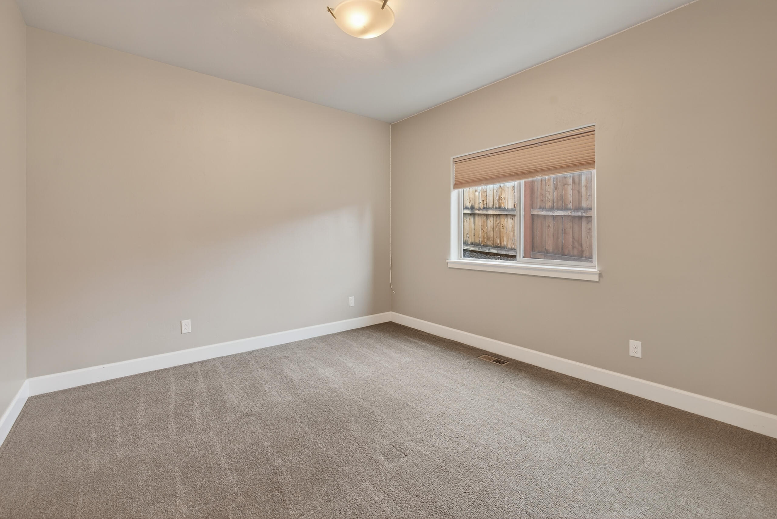 2793 Southwest 33rd Street Redmond, OR 97756 - Photo 25 of 44 an empty room with a window