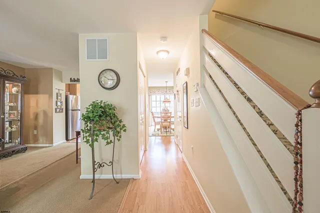 a view of entryway with wooden floor