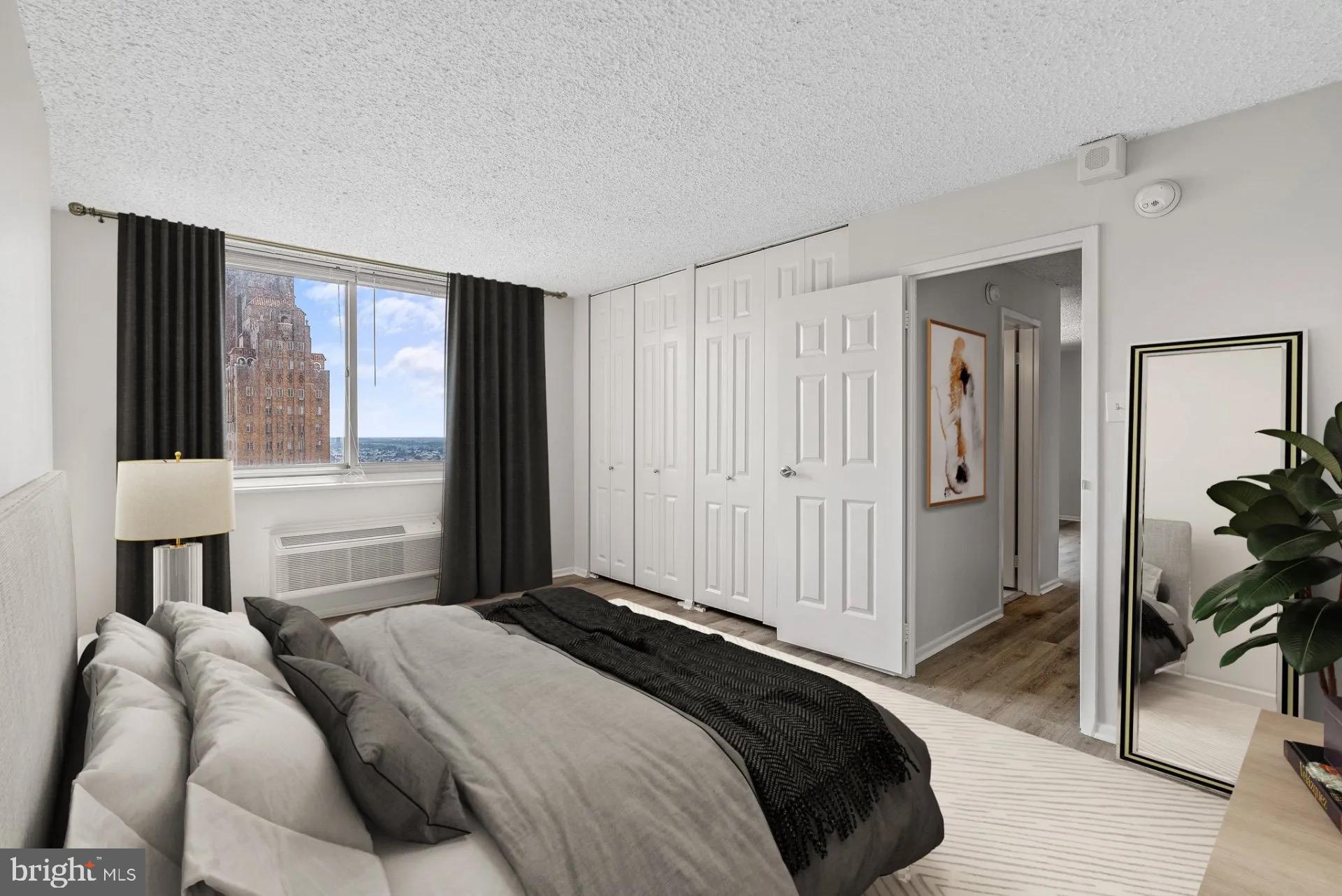 1500 Locust Street, Unit 1B1614 Philadelphia, PA 19102 - Photo 24 of 25 a bedroom with a bed and a window