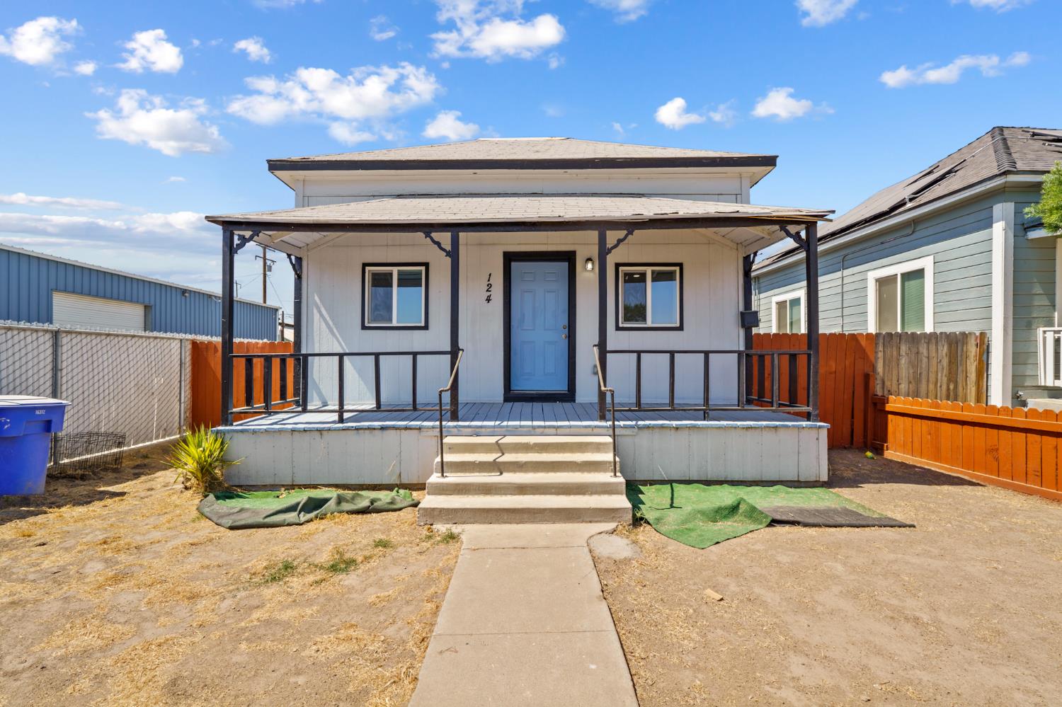 124 East 4th Street Hanford, CA 93230 - Photo 1 of 23 a front view of a house