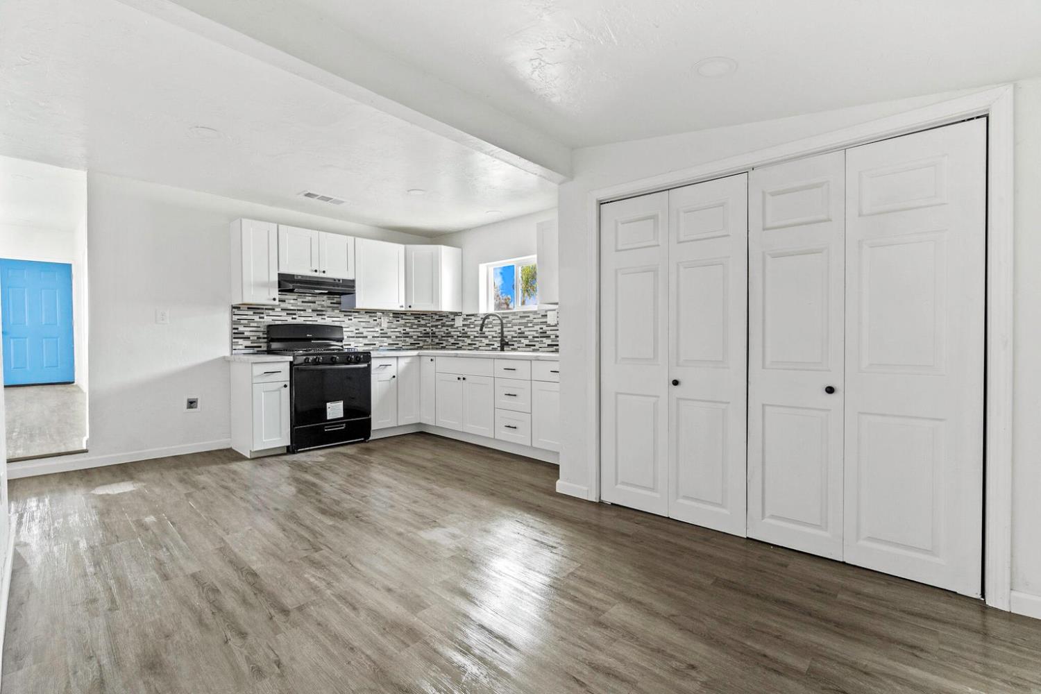 124 East 4th Street Hanford, CA 93230 - Photo 12 of 23 a view of a kitchen with a stove top oven