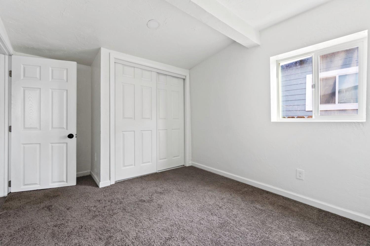 124 East 4th Street Hanford, CA 93230 - Photo 18 of 23 an empty room with windows