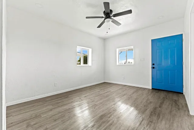 a view of a kitchen with wooden floor