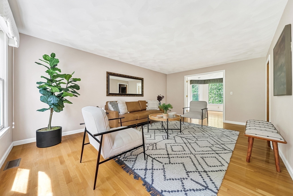 83 Jefferson Road Franklin, MA 02038 - Photo 3 of 34 a living room with furniture and a potted plant