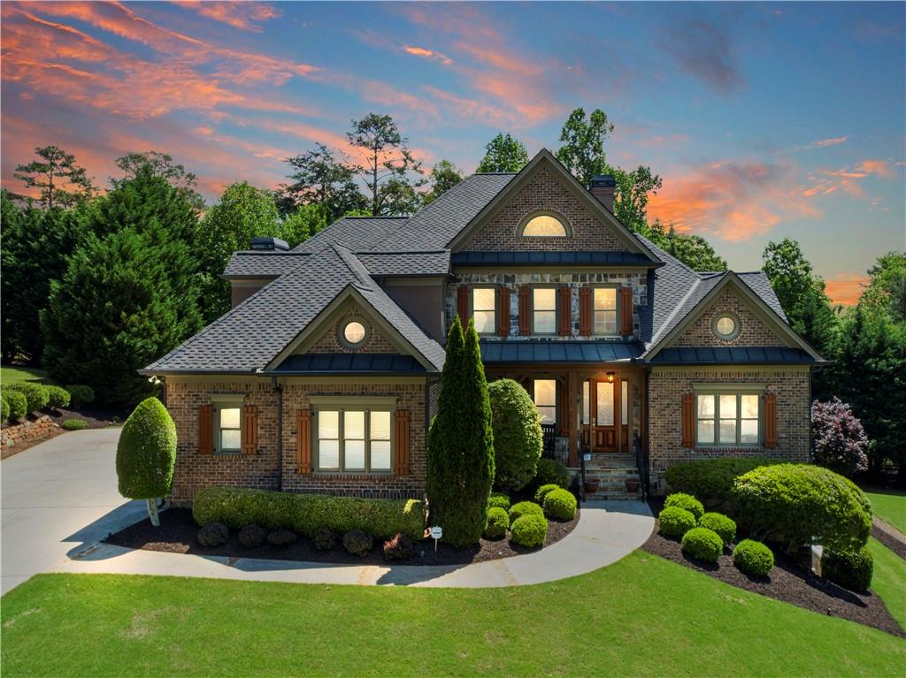 3623 Sunset Point Drive Gainesville, GA 30506 - Photo 1 of 1 a front view of a house with garden