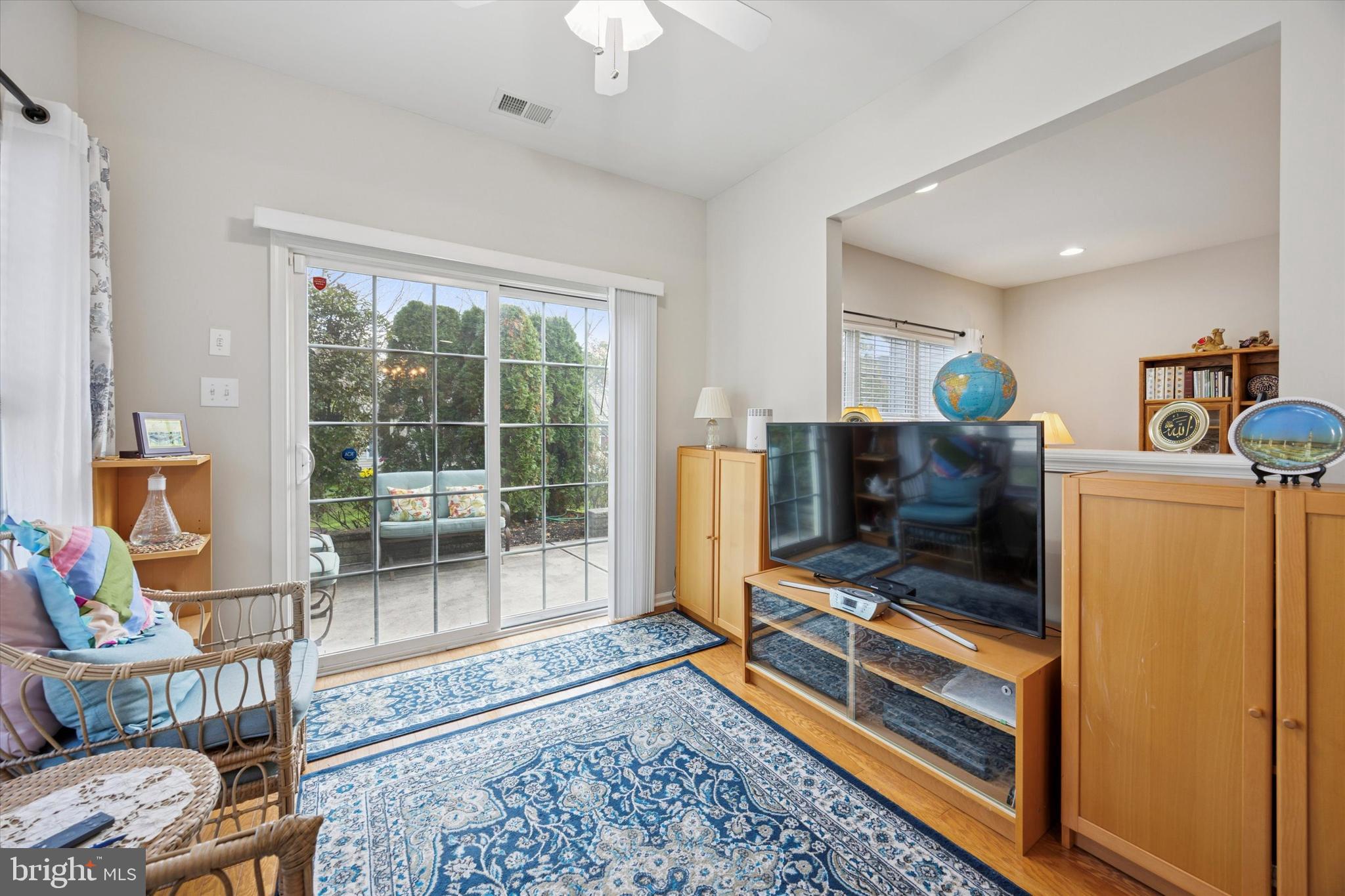 113 Summit Street Glassboro, NJ 08028 - Photo 14 of 25 a living room with furniture a flat screen tv and a rug