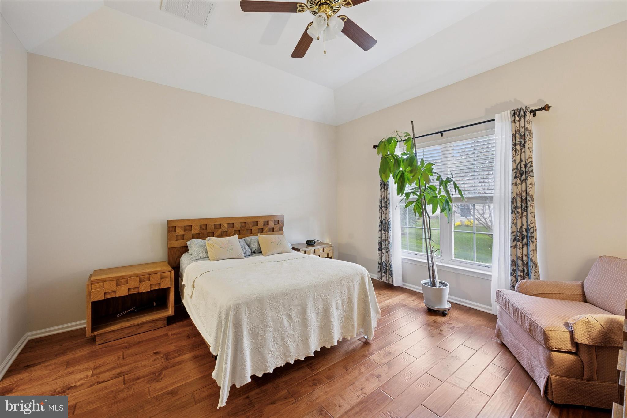113 Summit Street Glassboro, NJ 08028 - Photo 16 of 25 a bedroom with a bed couch and a potted plant