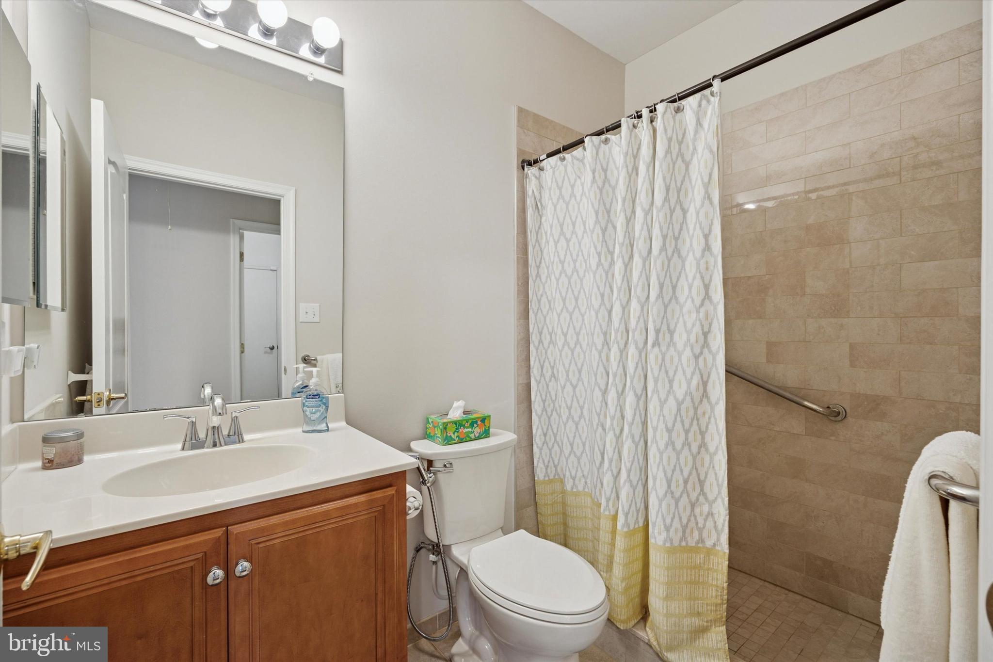 113 Summit Street Glassboro, NJ 08028 - Photo 22 of 25 a bathroom with a sink a toilet and shower