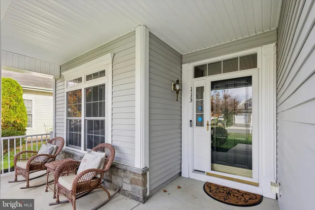 a building outdoor space with patio furniture and potted plants