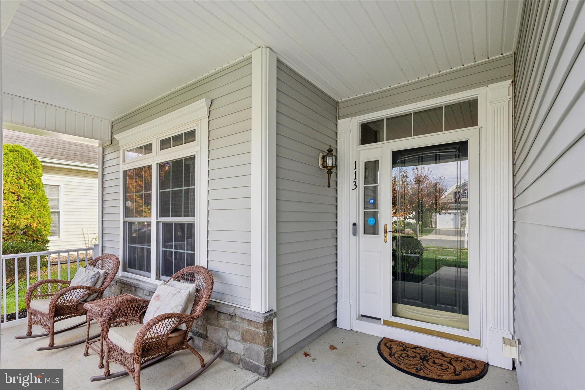 113 Summit Street Glassboro, NJ 08028 - Photo 3 of 25 a building outdoor space with patio furniture and potted plants