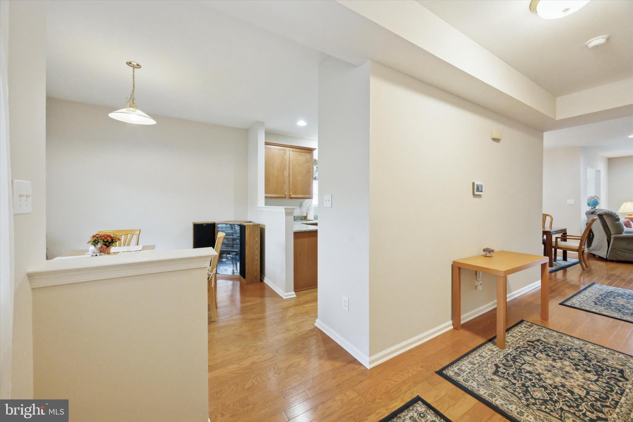 113 Summit Street Glassboro, NJ 08028 - Photo 4 of 25 a view of kitchen with furniture and wooden floor