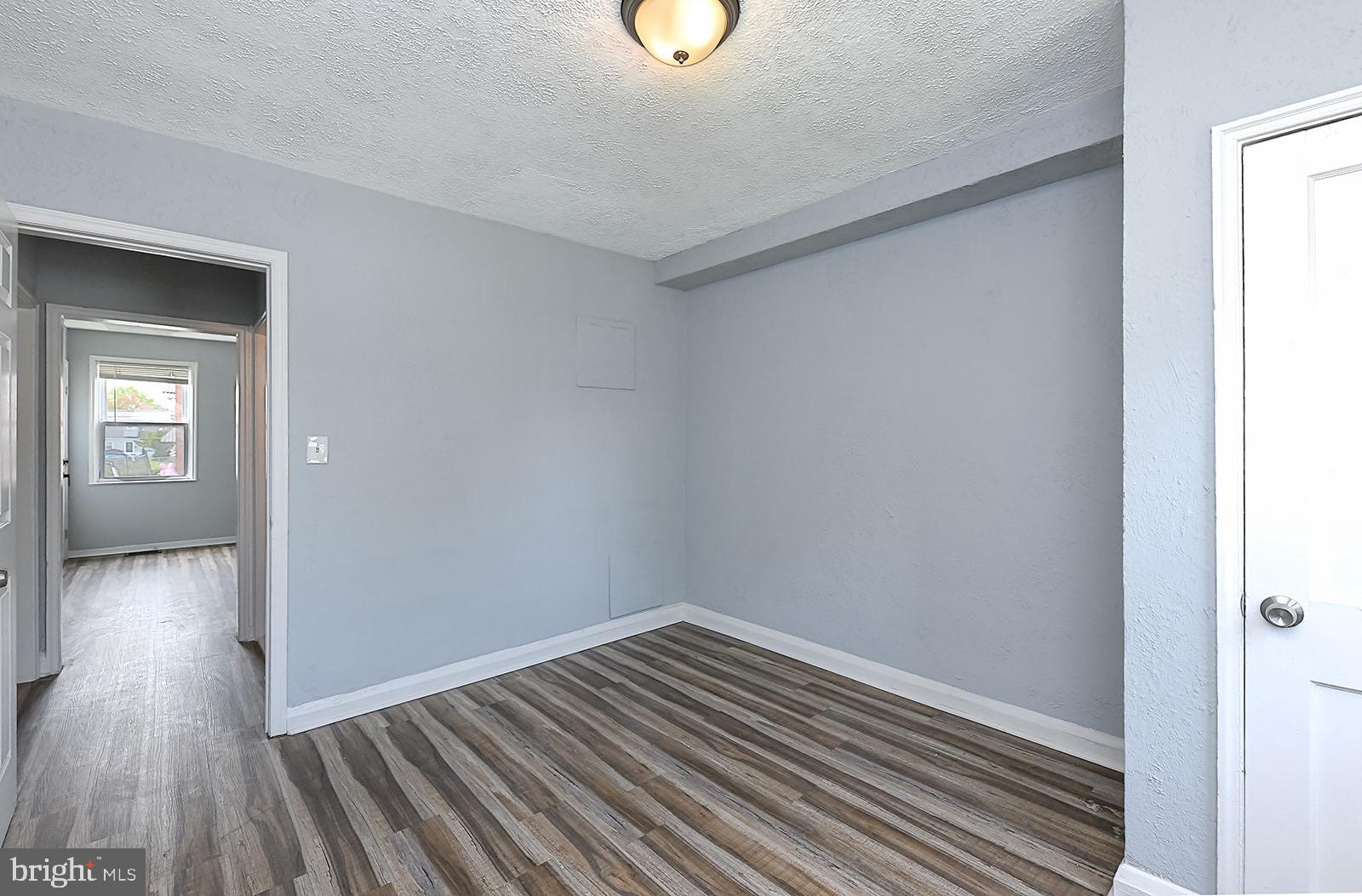 2995 Yorkway, Unit 1 Dundalk, MD 21222 - Photo 14 of 19 a view of a hallway with wooden floor and closet