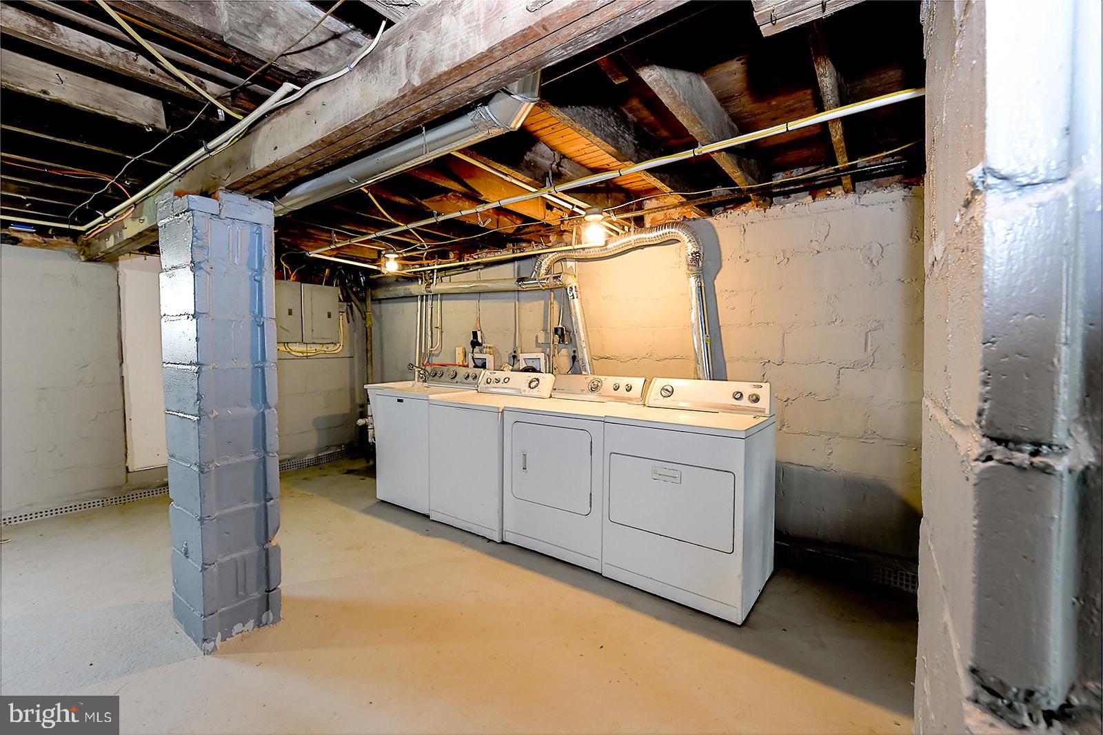 2995 Yorkway, Unit 1 Dundalk, MD 21222 - Photo 15 of 19 a utility room with cabinets dryer and washer