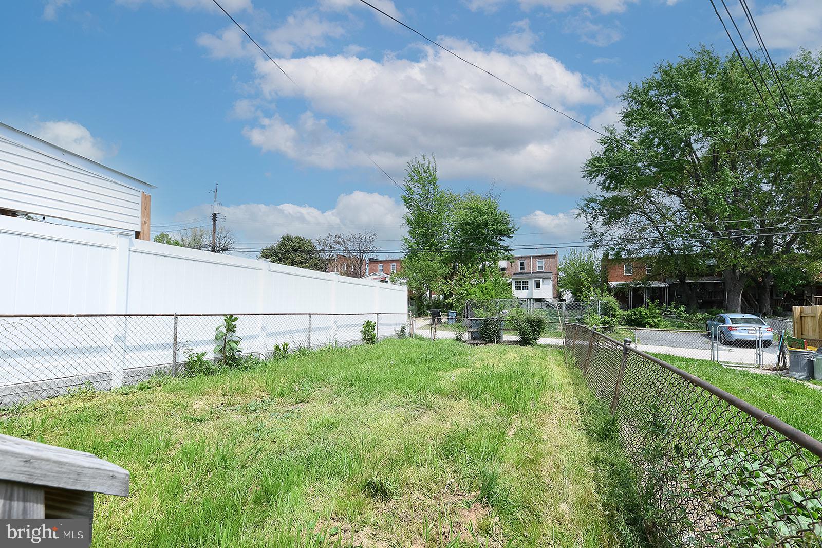 2995 Yorkway, Unit 1 Dundalk, MD 21222 - Photo 19 of 19 a view of backyard with seating area and green space