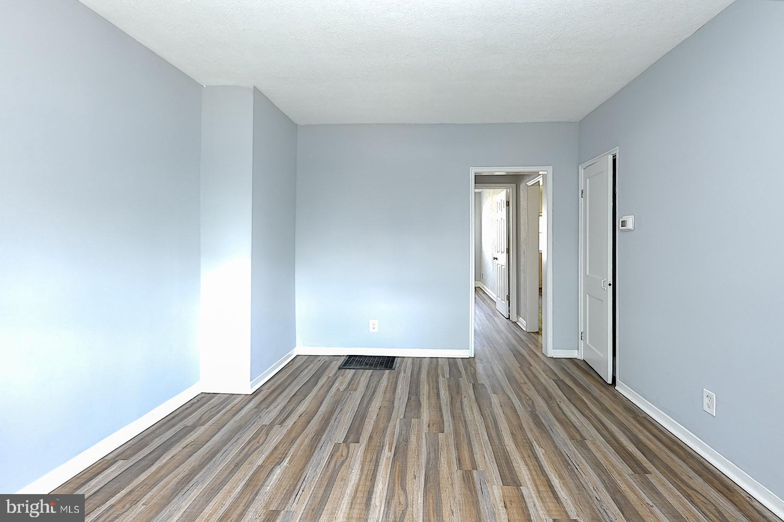 2995 Yorkway, Unit 1 Dundalk, MD 21222 - Photo 7 of 19 a view of a room with wooden floor and bench